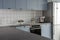 Modern stylish blue and gray kitchen with kettle and coffee machine