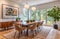 A modern and stylish dining room featuring sleek, trendy furniture, a minimalist wooden dining table, and elegant chairs, accented