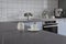 Modern stylish minimalist blue and gray kitchen with cooking utensils