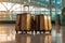 Modern stylish suitcases standing in empty airport hall, unrecognizable traveller\\\'s luggage