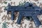 Modern submachine gun MP5 on desert camouflaged background