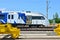 Modern subway rolling stock and European high-speed passenger train on an open railway area of the rail car assembly plant