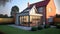 Modern Sunroom or conservatory extending into the garden, surrounded by a block paved patio