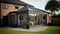 Modern Sunroom or conservatory extending into the garden, surrounded by a block paved patio