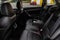 Modern SUV car inside. Leather black back passenger seats in modern luxury car with opened armrest.