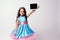 Modern technologies. Beautiful little girl. Lush blue dress