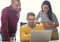 Modern technology has improved employee productivity and efforts. coworkers working together on a laptop in an office.