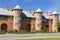 Modern three-story brick house with towers