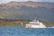 Modern tour boat, catamaran is sailing with tourists at Beagle Channel to watch wildlife in Patagonia, near Ushuaia, Argentina