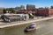 Modern tourist pink boat floating on the Moscow river near the Bersenevskaya embankment, top view. Moscow