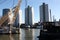 The modern and touristic port of Rotterdam on a sunny spring day. In the metropolis boats, ships and fishing boats wake up in the