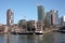 The modern and touristic port of Rotterdam on a sunny spring day. In the metropolis boats, ships and fishing boats wake up in the