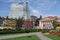 The modern tower of the Radisson Blu hotel rises up over an old apartment block and the State Drama Theatre in central Batumi, Geo