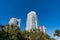 Modern towerblocks high-rise buildings architecture and palms on blue sky in South Beach, USA