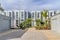 Modern townhouse in Huntington Beach California against cloudy sky on sunny day