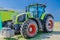 Modern tractor for agriculture on the farm with a powerful motor