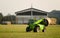 Modern tractor moving hay bales