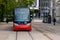 Modern tram on half-empty Riga streets, traditional public transport