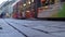 Modern tram passing crowded street in old city downtown, public transportation