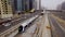 Modern tram travels on rails along the high-rise buildings in Dubai, UAE