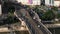 Modern tram unit approaching tram stop in centre of multilane thoroughfare in city. Aerial view of transport