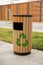 Modern trash bin with a recycling sign