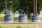 Modern trash cans round containers in park for separate collection of garbage