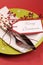 Modern trend lime green and red Merry Christmas table place setting. Vertical