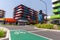Modern trendy bright colors apartment blocks from street with green cycle land and cycle graphic