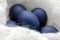 Modern trendy classically blue Easter eggs of the original color on a light wool background close-up with a place for