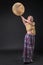 Modern Tribal Woman playing shaman drum