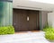 Modern two family house entrance marble steps with double doors and plants