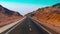 Modern two-lane deserted highway. Road, stones and sand