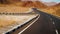 Modern two-lane deserted highway. Road, stones and sand