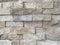 Modern uneven horizontal narrow bricks of stone rock tiles placed on each other as contemporary natural material indoors or