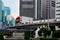 Modern urban image with BTS skytrain transport and skyrise buildings central Bangkok Thailand