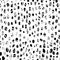 Modern vector seamless pattern with small abstract pebble like shapes in grey and black color