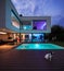 Modern villa with colored led lights at night