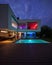 Modern villa with colored led lights at night