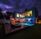 Modern villa with colored led lights at night