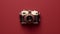 Modern Vintage Camera On Red Background Stock Photo