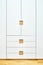 Modern wardrobe with finger pull design. Wooden wardrobe with light gray cabinet doors. Modern furniture