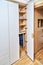 Modern wardrobe with finger pull design. Wooden wardrobe with light gray cabinet doors. Modern furniture