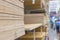 Modern warehouse with construction wood materials on metal shelves. Selective focus. Repair and construction concept. Buyers