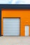 Modern warehouse entrance with orange front