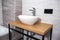 Modern washbasin bowl in bathroom and wooden table. Modern bathroom interior.