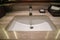 modern washbasin with hot and cold faucet in luxury hotel bathroom