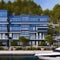 A modern waterfront residential complex with sleek, glass facades and private marina access3