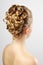 Modern wedding hairstyle. On gray