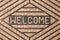 Modern welcome doormat as background